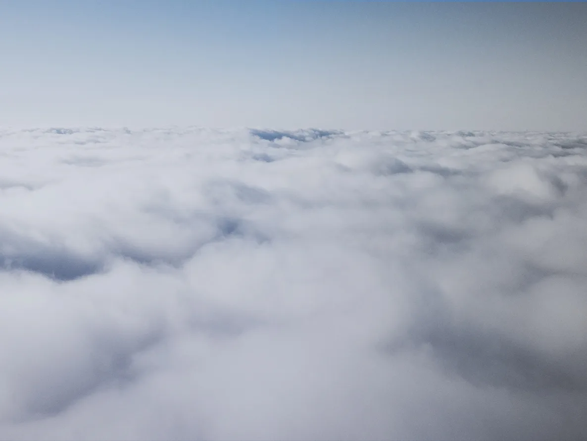 Gray sky with heavy clouds. Hybrid cloud environment.